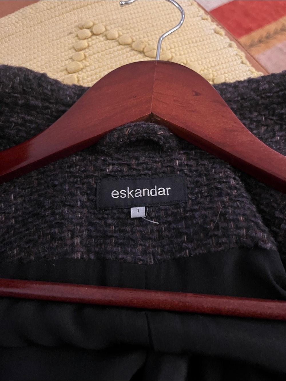 eskandar jacket, black and brown with Dolman sleeves, and five buttons